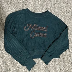 “Miami Canes” slightly cropped, dark green crew neck, size M